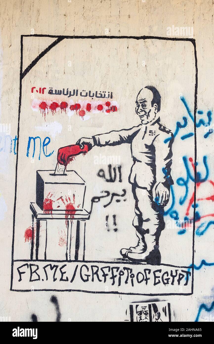 Egypt, Cairo, graffiti of the Egyptian revolution. It says that the army uses blood of Egyptian people and the elections, in order to get power. Stock Photo