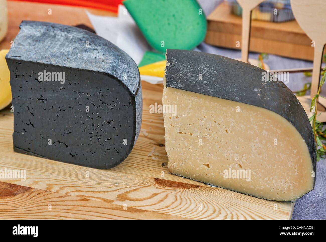 Semi soft cows milk cheese closeup for sale at a outdoor market stock
