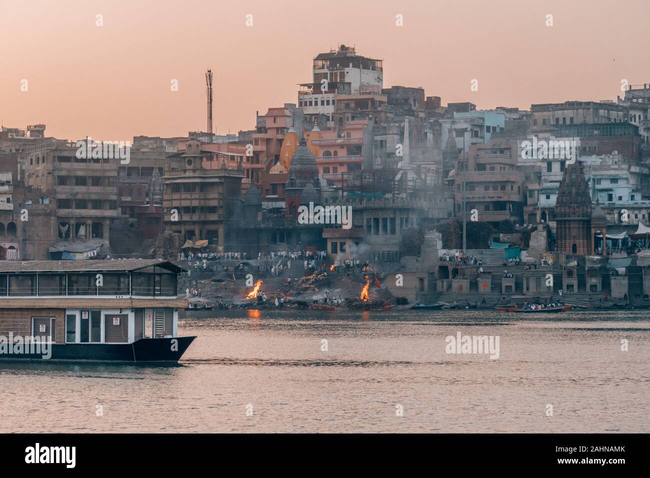 Cityscape of the holy city of Varanasi, India with the famous Ghats in front of the Ganga River Stock Photo