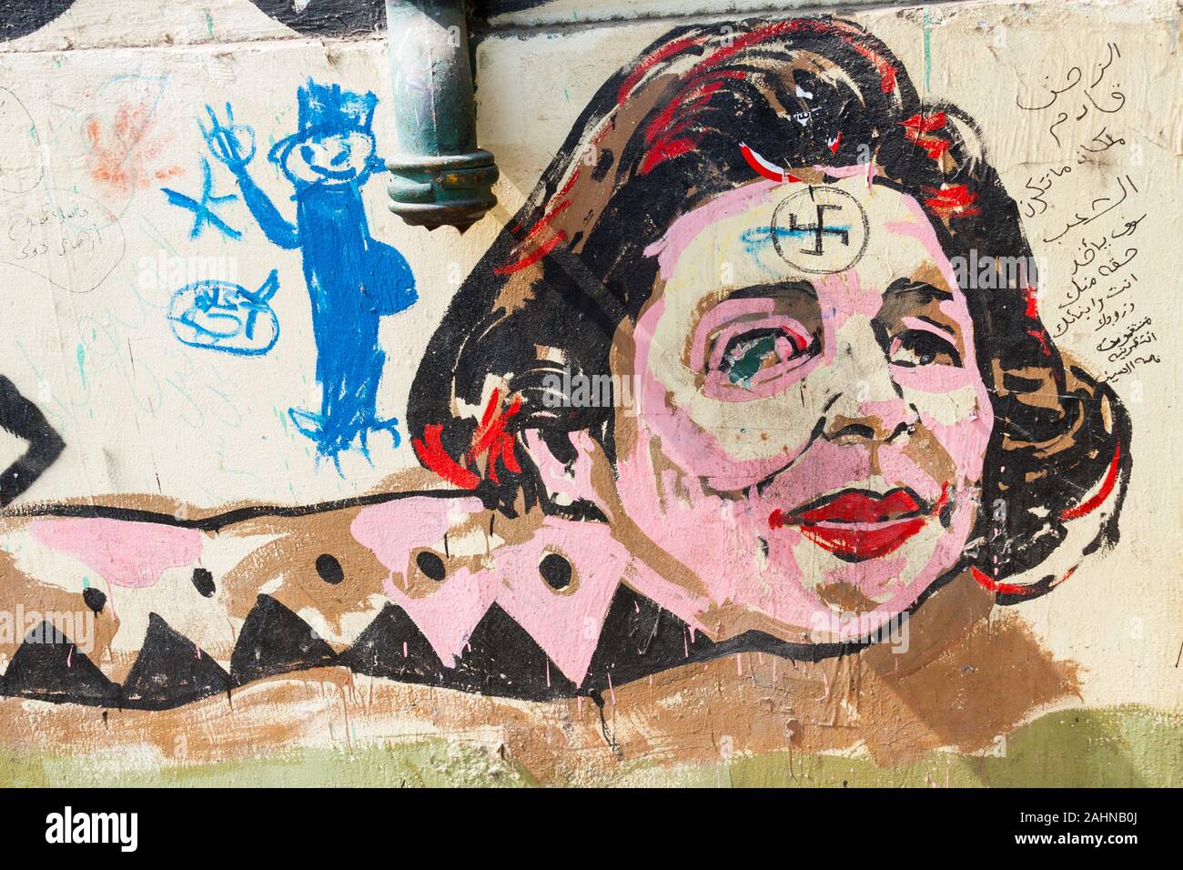 Egypt, Cairo, graffiti of the Egyptian revolution on the walls of American University, Mohamed Mahmoud Street. Detail of a giant snake. Stock Photo