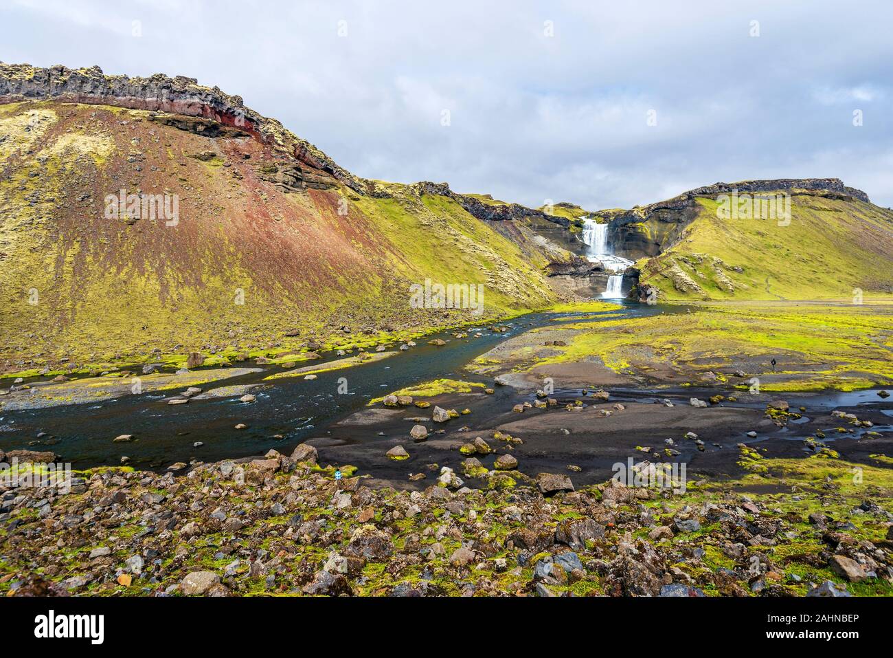 Landscape of Eldgja Canyon floor with the flow of Nordari-Ofaera river and Ofaerufoss waterfall in southern highlands of Iceland. The west of Vatnajok Stock Photo