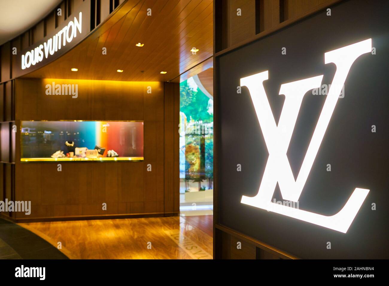 SINGAPORE - CIRCA APRIL, 2019: close up shot of LV sign at Louis Vuitton store in the Shoppes at Marina Bay Sands. Stock Photo