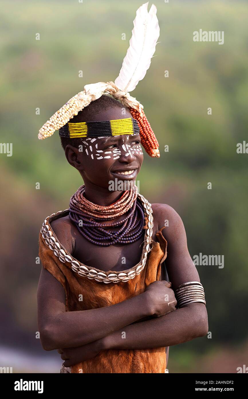 Karo tribe, Young tribal Karo boy with painted face and corn and fur decoration on his head, Omo valley, Ethiopia, Africa Stock Photo