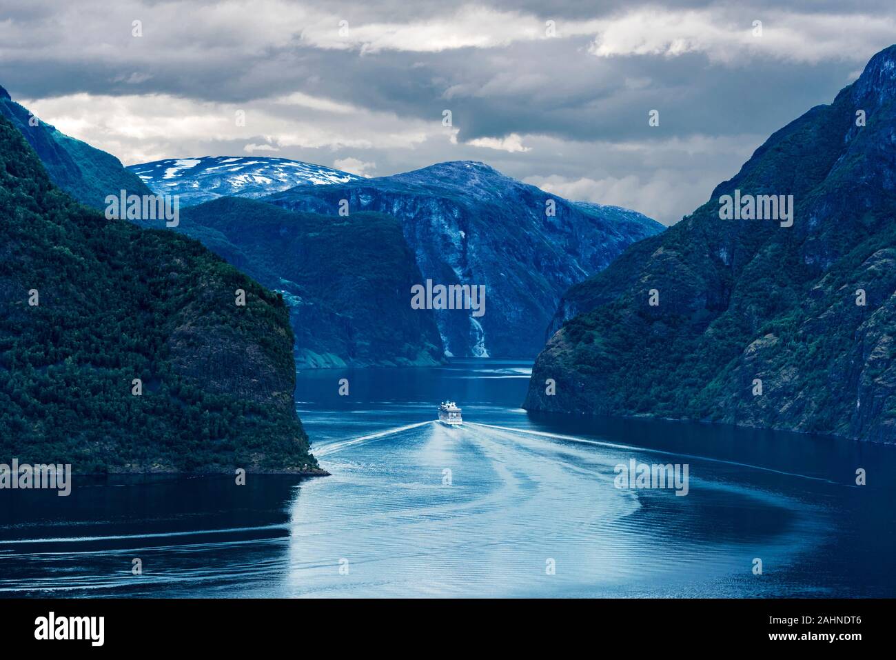 View of Aurlandsfjord from Stegastein viewpoint in Sogn og Fjordane county of Norwey. Cruise ship is moving via Sognefjorden, Norway's longest fjord. Stock Photo