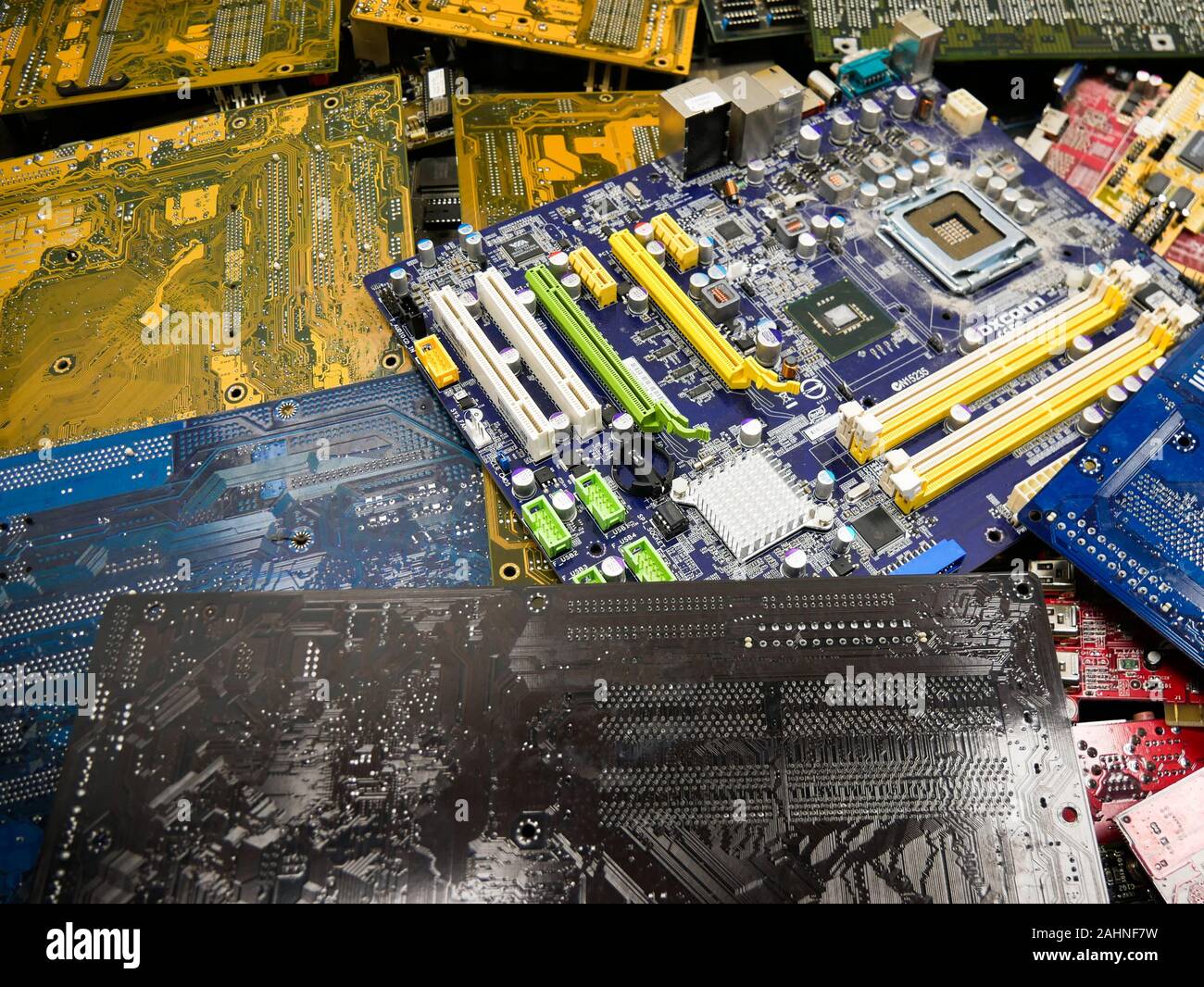 Wien/Austria - june 4 2019: pile of discarded computer mother boards  sorted on a bin  in a recycling and recovery compound in vienna Stock Photo