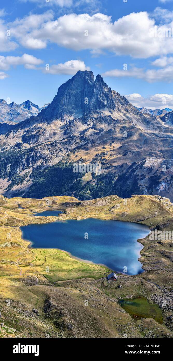 Vertical panoramic view at Midi Ossau mountain peak and Lake Gentau from the mountain pass Ayous in Franch Atlantic Pyrenees, as seen in October. Aqui Stock Photo