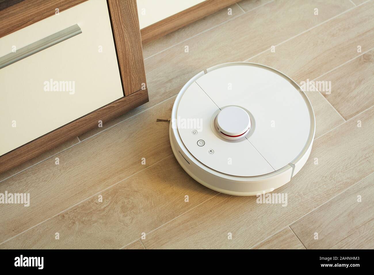 Smart House Vacuum Cleaner Robot Runs On Wood Floor In A Living