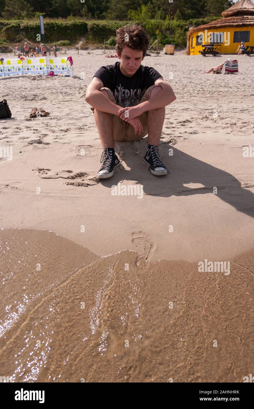 Lonely young man hi-res stock photography and images - Alamy