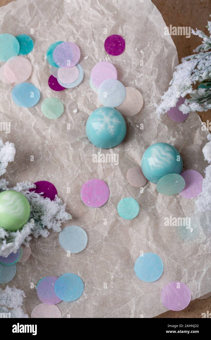 Holiday chocolate candy and confetti Stock Photo - Alamy
