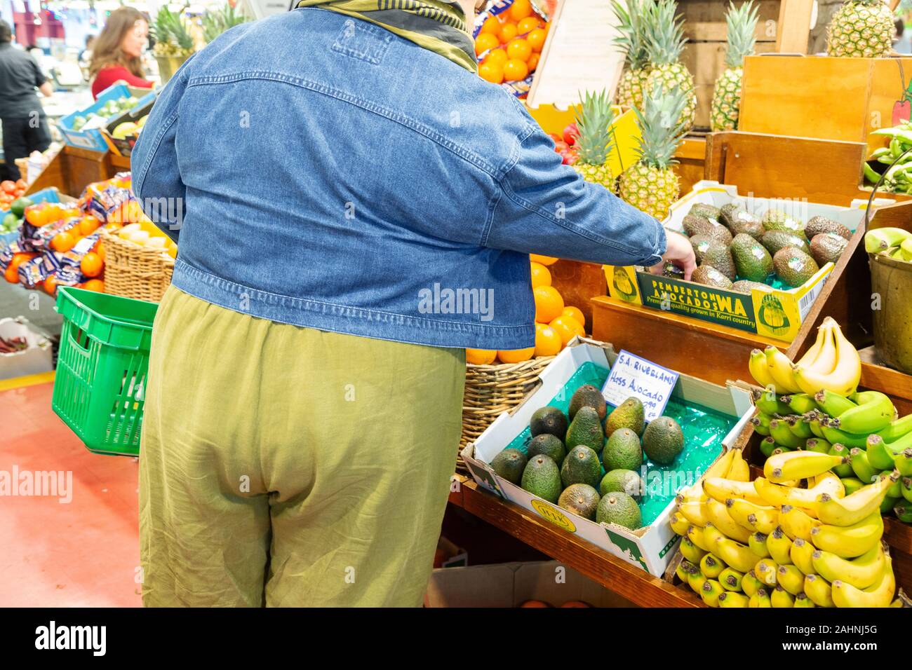 Australia obesity - an obese person buying food, in a food market, rear view,  Australia Stock Photo
