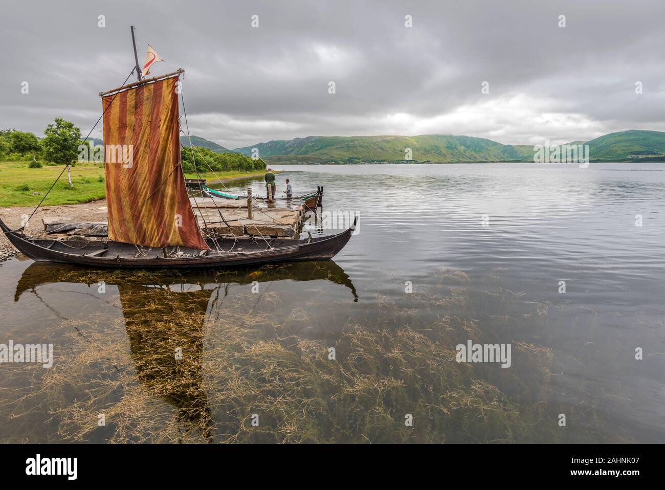 Lofotr, Norway - August 2, 2017  Reconstructed Viking ships in the border of Innerpollen salty lake in Vestvagoy island of Lofoten archipelago. The ar Stock Photo