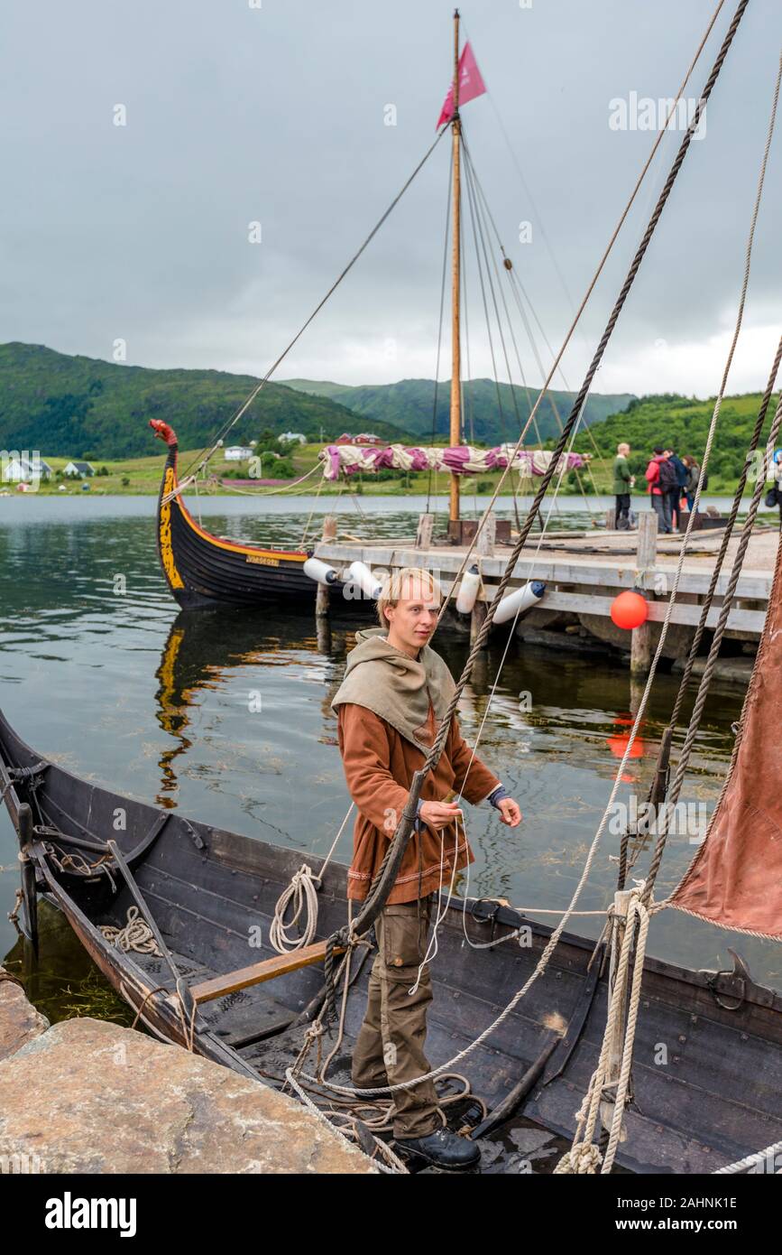 Lofotr, Norway - August 2, 2017  Man preparing Reconstructed Viking boat in the border of Innerpollen salty lake in Vestvagoy island of Lofoten archip Stock Photo