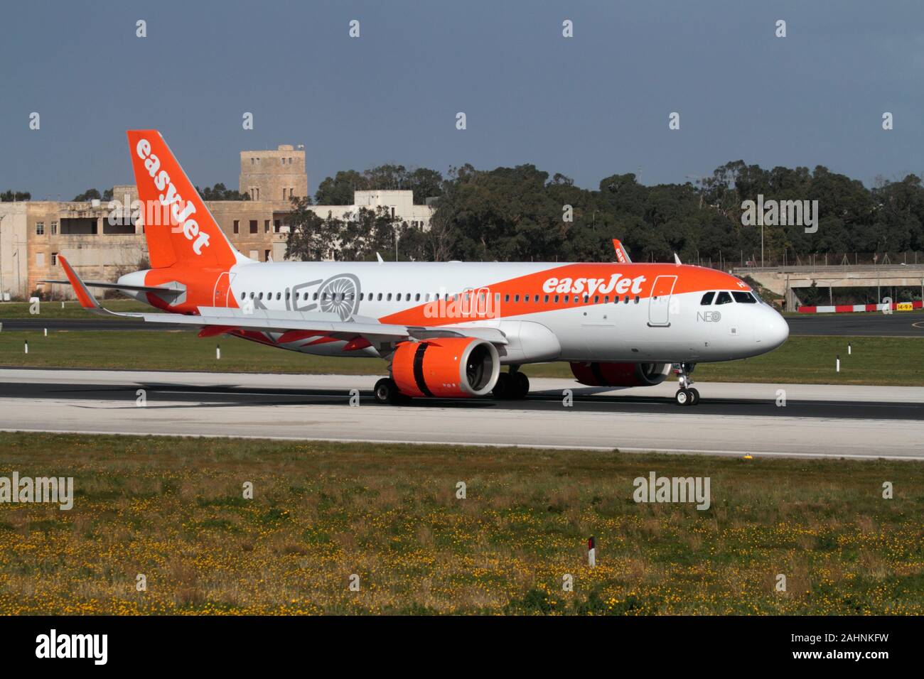 easyJet Airbus A320neo (A320-200N) commercial airliner arriving on a budget flight to Malta. Modern air travel and low cost Mediterranean holidays. Stock Photo