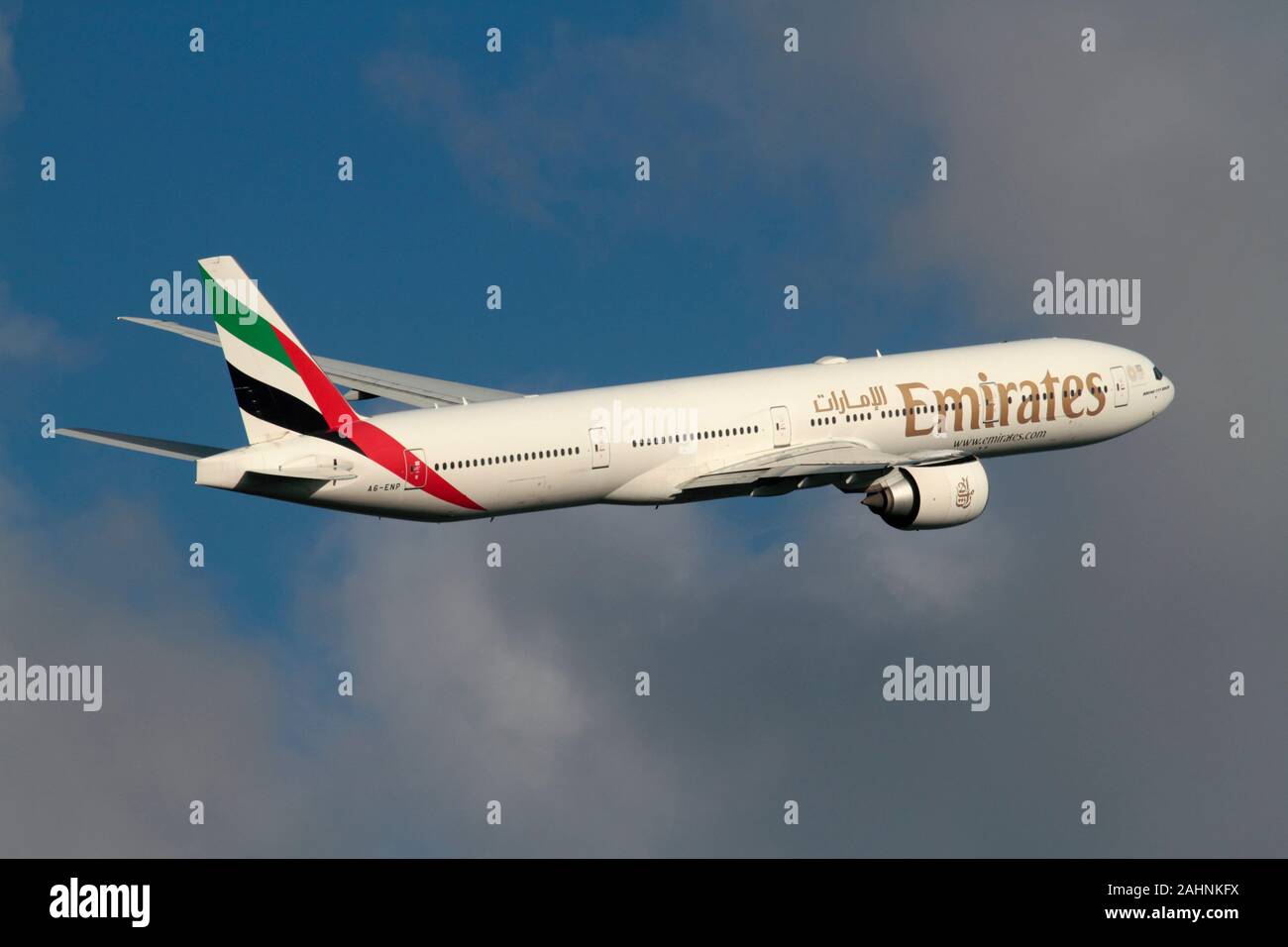 Emirates Boeing 777-300ER long haul passenger jet plane flying in the sky  and climbing on departure Stock Photo - Alamy