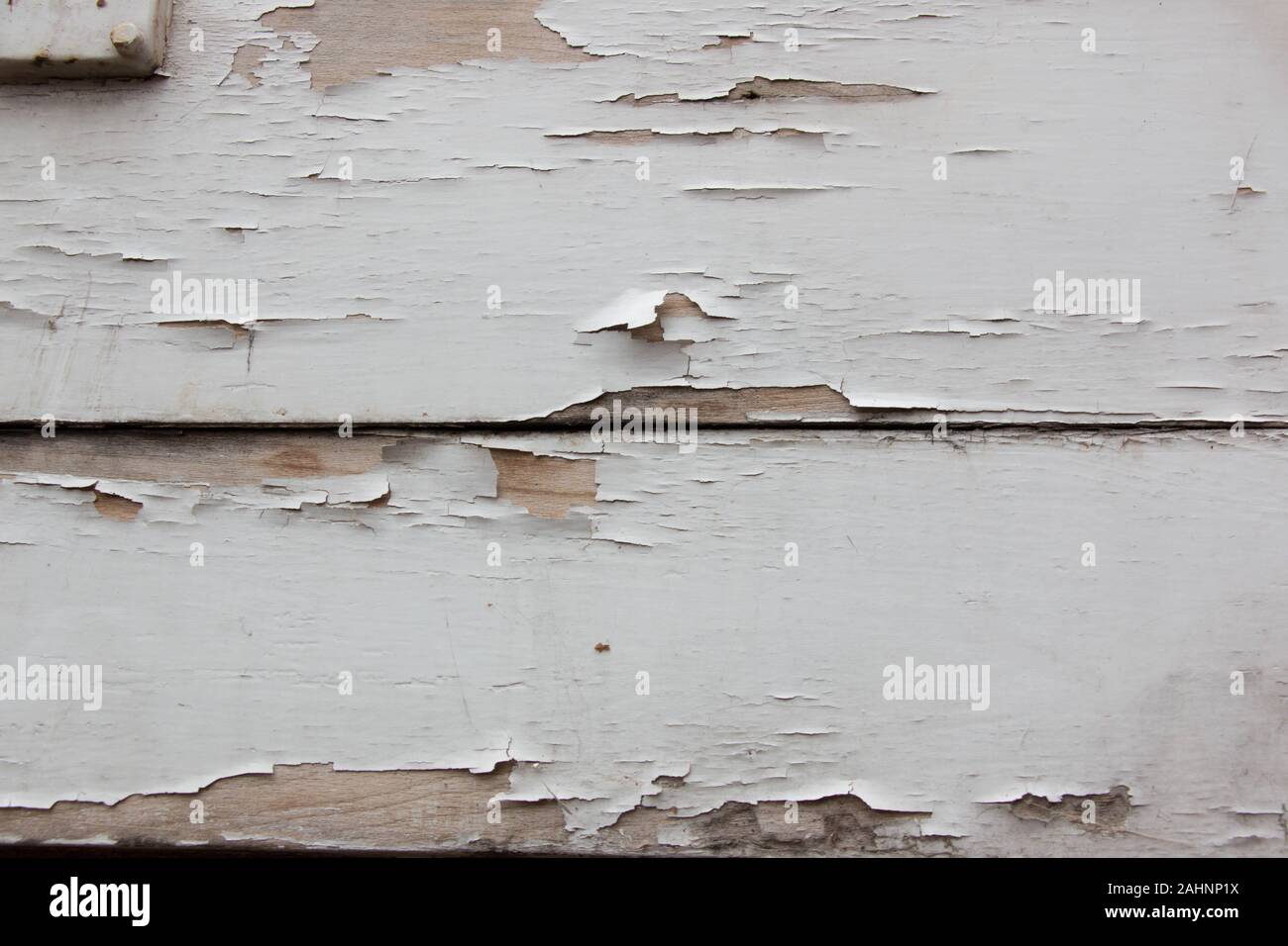 Wooden shutter with peeling white paint Stock Photo