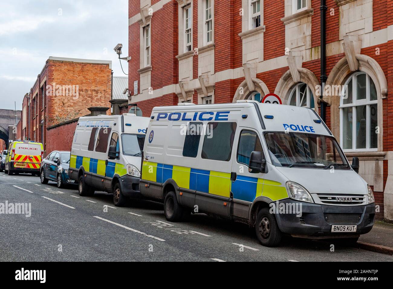 Police vehicles parked outside a police station in Birmingham City Centre, West Midlands, UK. Stock Photo