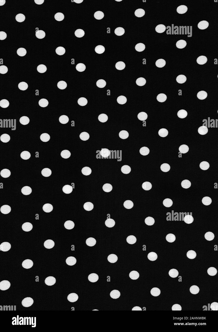 Black and white colored polka dot piece of polyester and spandex material background. This is a high resolution scan showing all the detail. Stock Photo