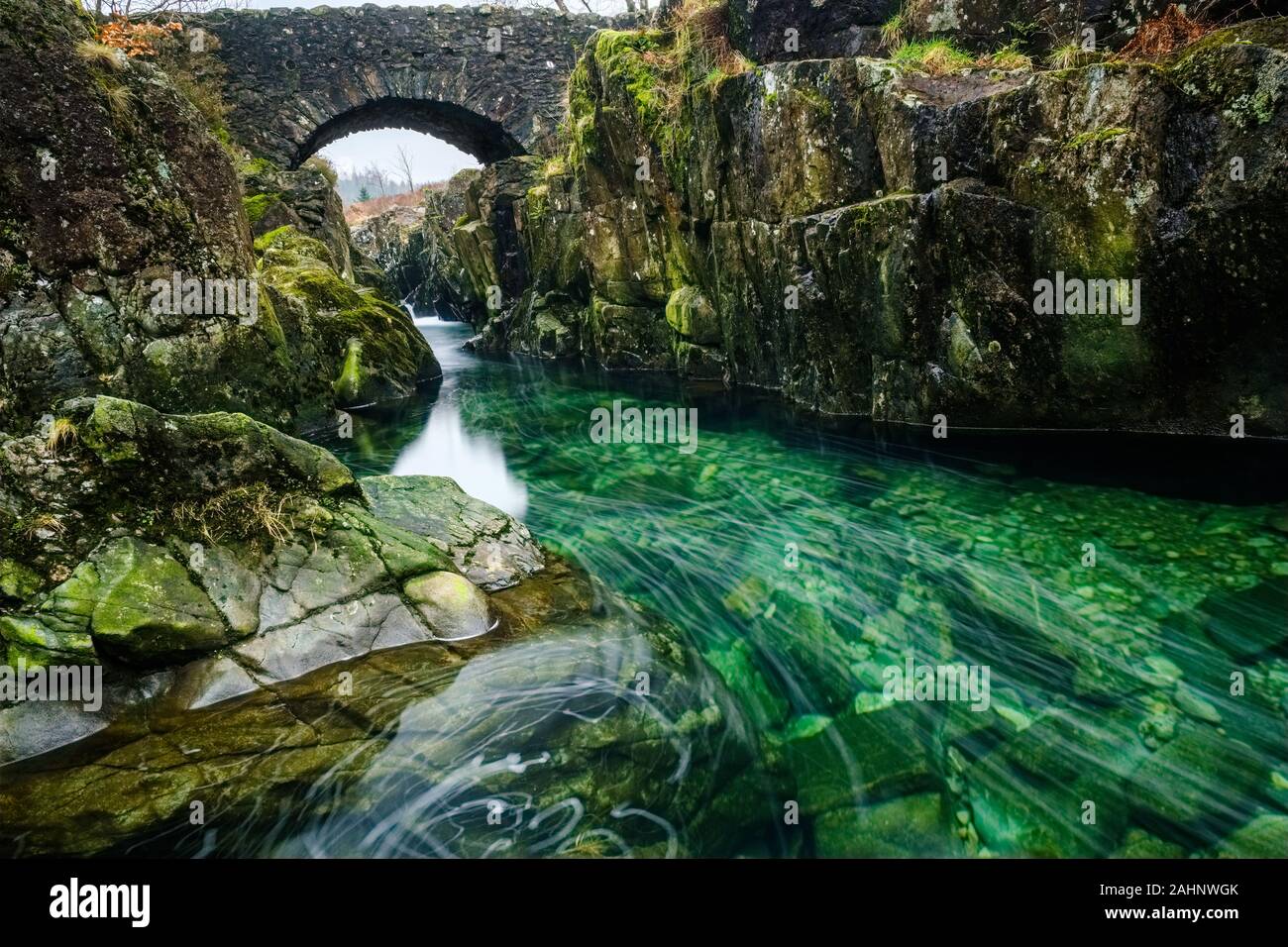 Long exposure image of the River Duddon flowing under Birks Bridge in the English Lake District Stock Photo
