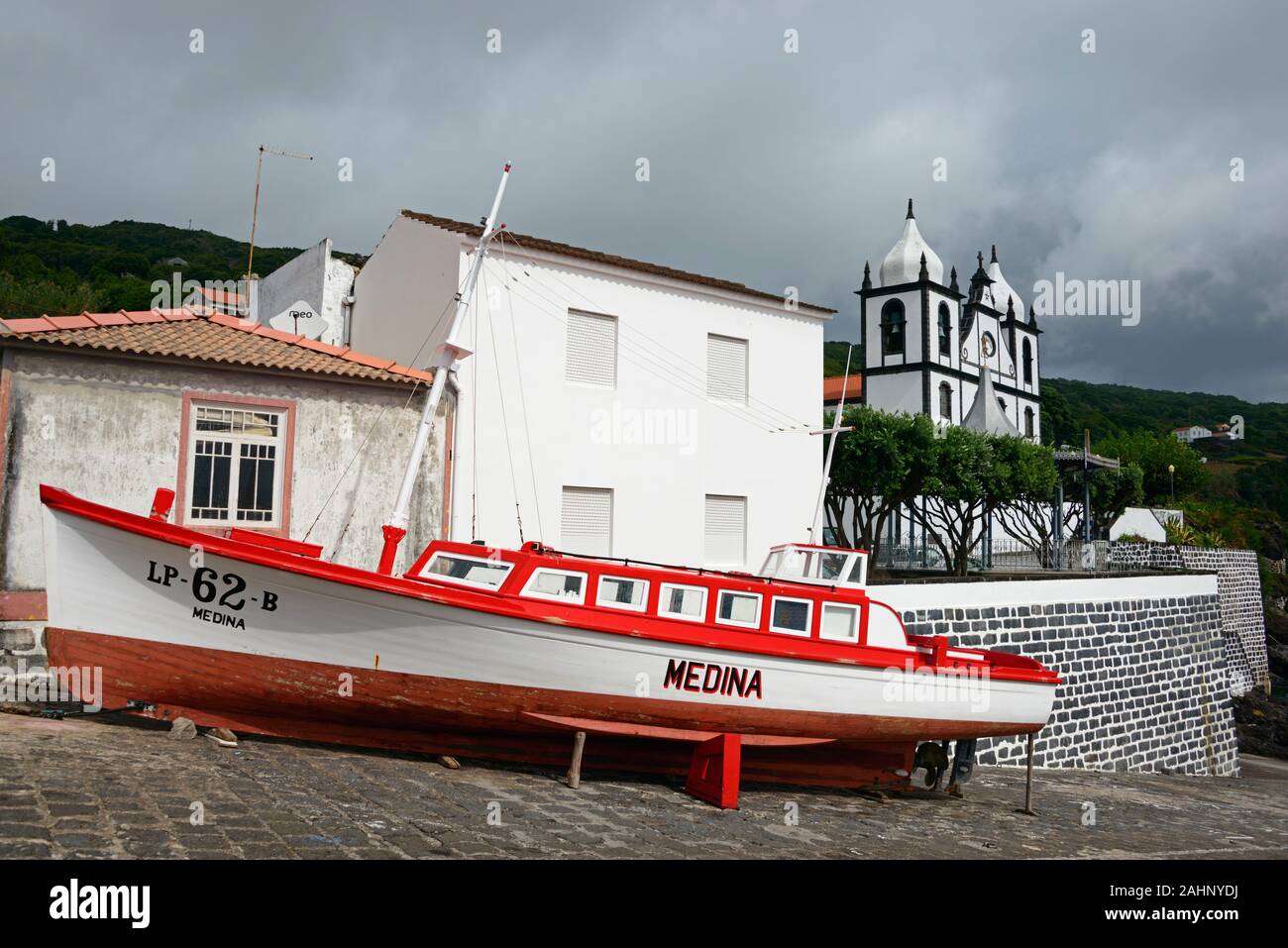 Boat and parish church, Calheta de Nesquim, Pico, Azores, Portugal / Sao Sebastiao|Boot und Kirche am Hafen, Calheta de Nesquim, Pico, Azoren, Portuga Stock Photo