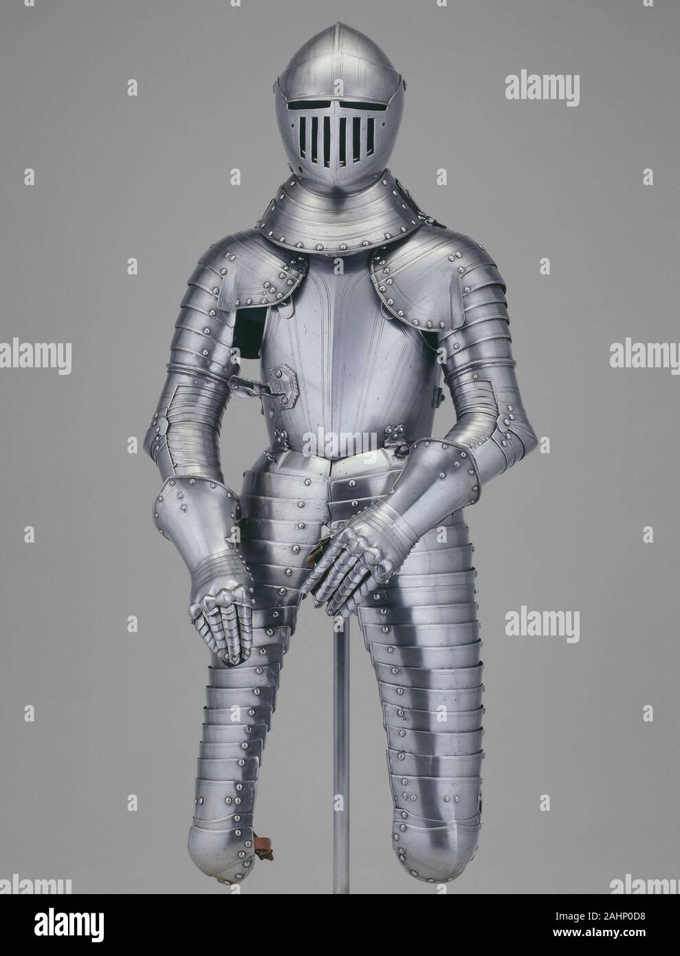 Armor for Heavy Calvary (Cuirassier). 1605–1615. Milan. Steel and leather This harness represents one of the last vestiges of fully armored cavalry, known as cuirassiers, trained to charge the enemy with a lance. By the 17th century firearms dominated the battlefield. In response to this development, the armorer of this piece made the breastplate and helmet thicker to resist the impact of musket fire. The dent on the breastplate, visible under the right arm, is a proof mark made when the armorer fired a musket at the piece to guarantee to his client that the armor was indeed shot-proof. Remark Stock Photo