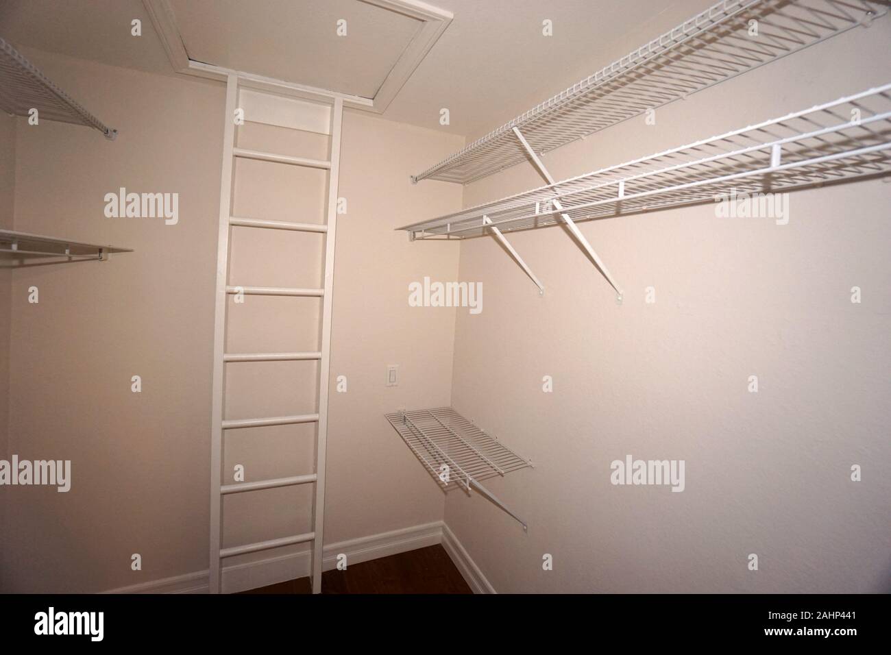 Walk-in Closet with Wire Shelving Stock Photo
