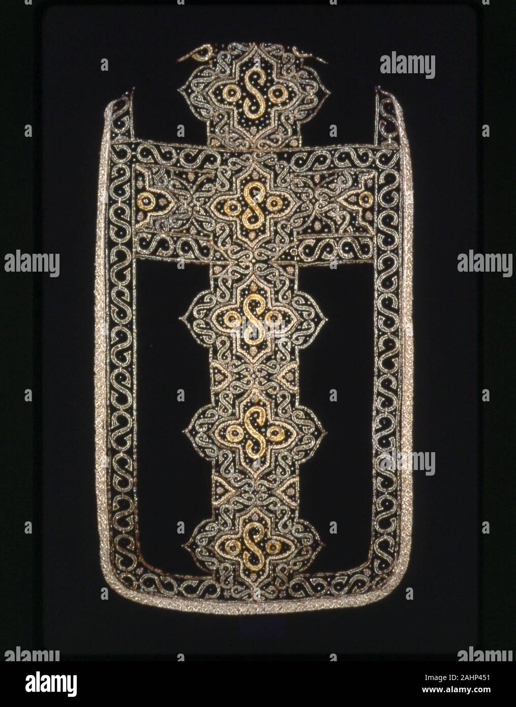 The Stafford Chasuble. 1620–1640. England. Silk, broken warp chevron twill weave, cut solid velvet; appliquéd with silk, satin weave; embroidered with gilt-metal strips and purl, gilt-metal-wire-wrapped linen, and gilt-metal-strip-wrapped silk in laid work and couching; edged with gilt-metal-strip-wrapped silk, bobbin straight lace Stock Photo