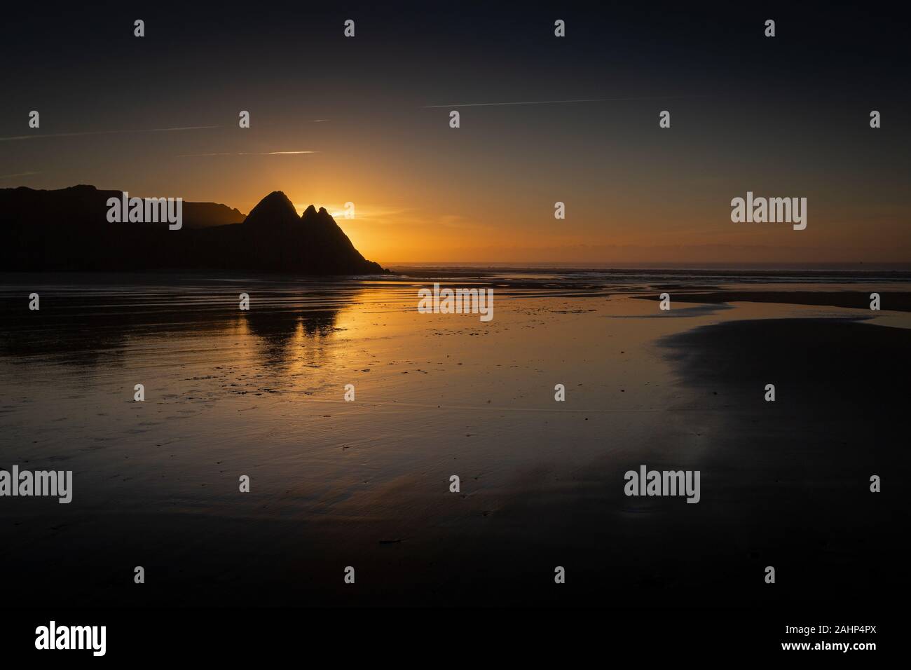 Sunrise at Three Cliffs Bay Stock Photo
