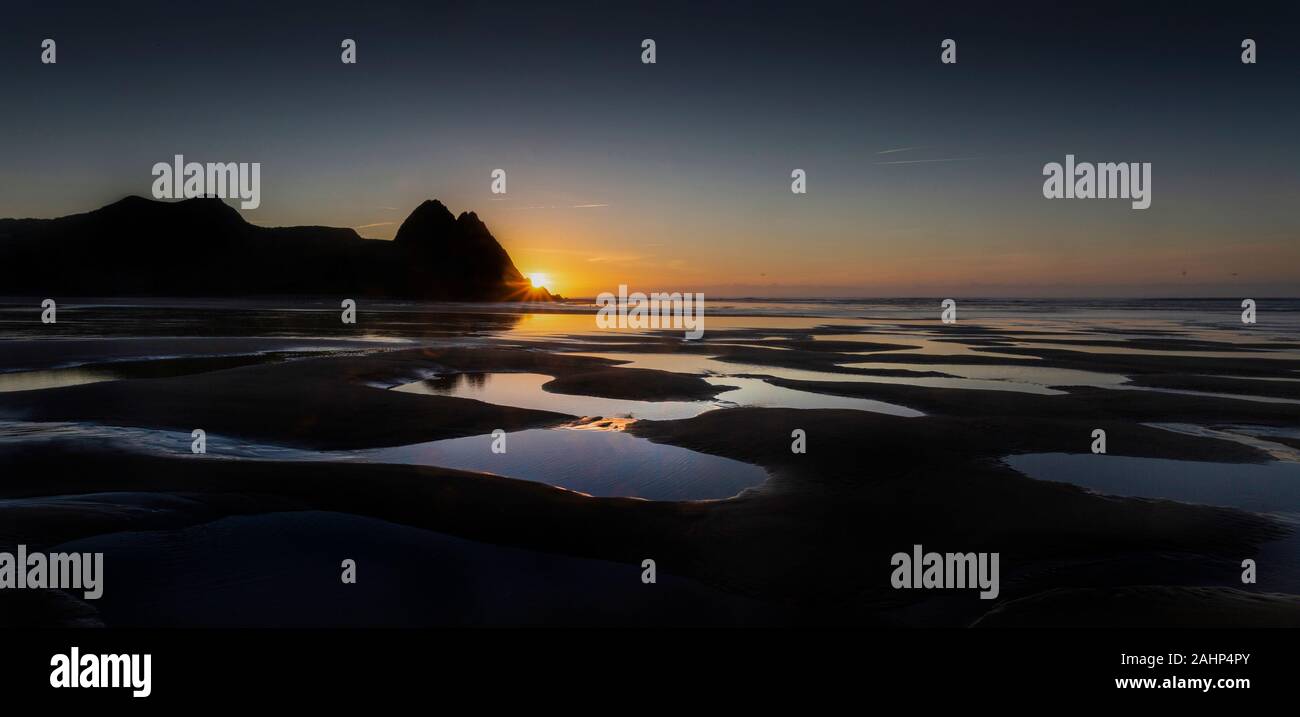 Dawn at Three Cliffs Bay Stock Photo
