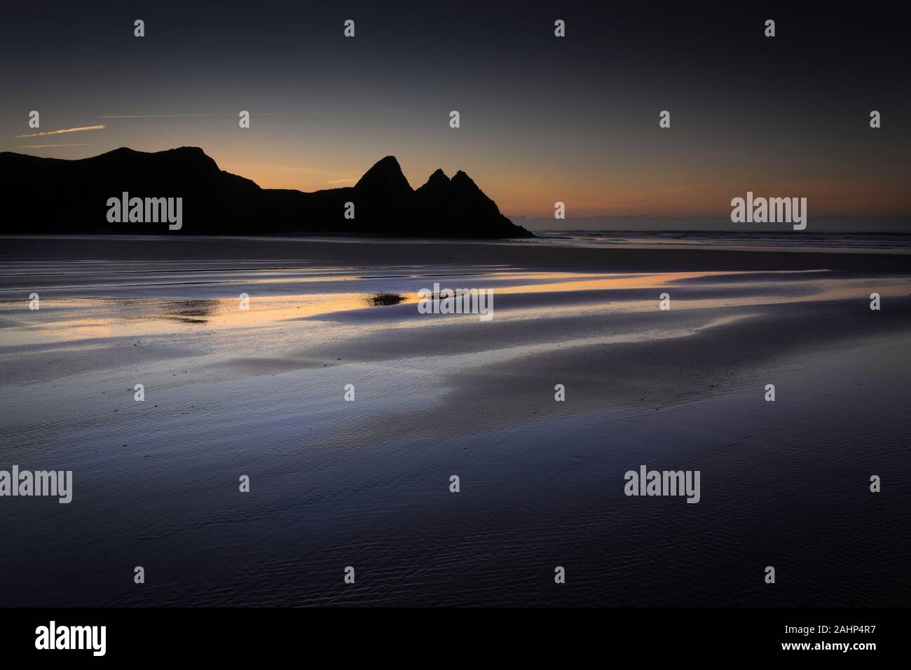 Daybreak at Three Cliffs Bay Stock Photo