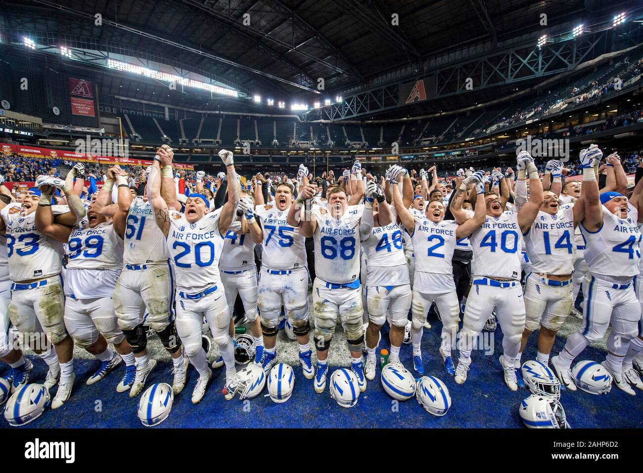 The U.S. Air Force Academy football players join together in a victory cheer following victory over Washington State University in the Cheez-It Bowl championship game at Chase Field December 27, 2019 in Phoenix, Arizona. Air Force defeated Washington State 31-21 to finish their season with an 11-2 record and an eight game win streak making it the third best season in program history. Stock Photo