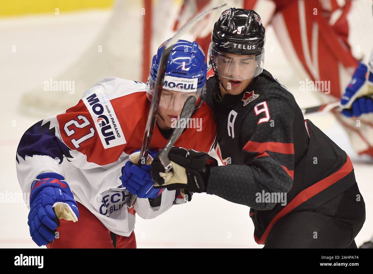 Ostrava, Czech Republic. 31st Dec, 2019. L-R Jaromir Pytlik (CZE) and Joe  Veleno (CAN) in action during the 2020 IIHF World Junior Ice Hockey  Championships Group B match between Canada and Czech