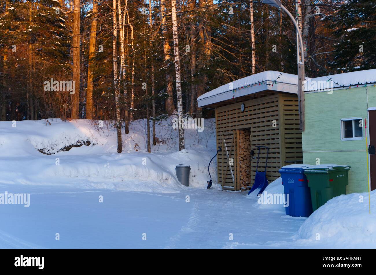 Lac Brochet winter picture, Wood shed ready for winter, Lac Brochet, Saint-David-de-Falardeau, Quebec, Canada Stock Photo