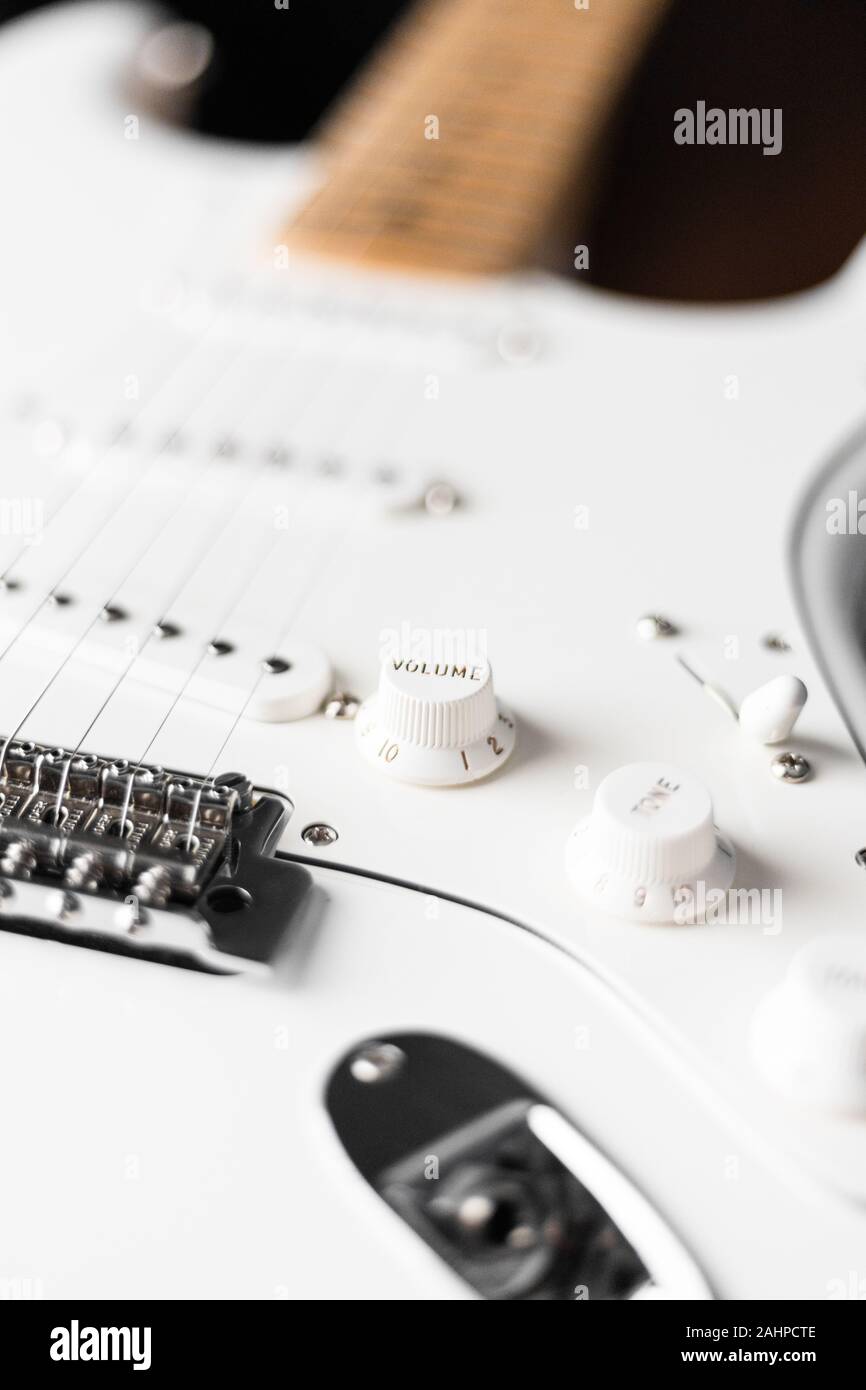 volume knob of white electric guitar blurry background Stock Photo Alamy