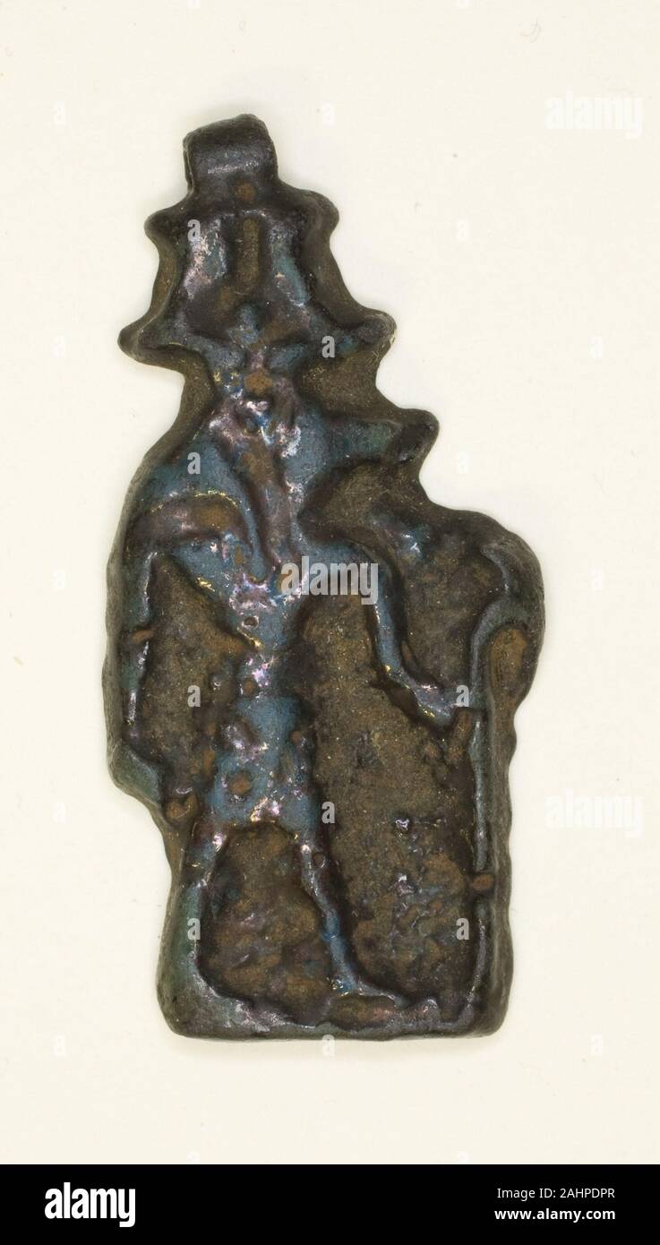 Ancient Egyptian. Amulet of the God Anubis wearing Atef Crown. 664 BC–332 BC. Egypt. Faience Stock Photo