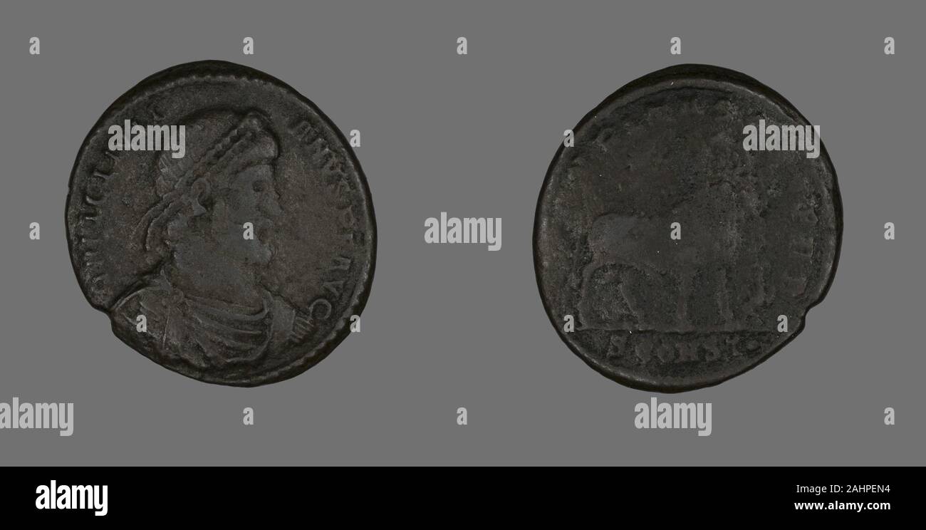 Ancient Roman. Base (Coin) Portraying Emperor Julianus. 360 AD–363 AD. Roman Empire. Bronze Stock Photo