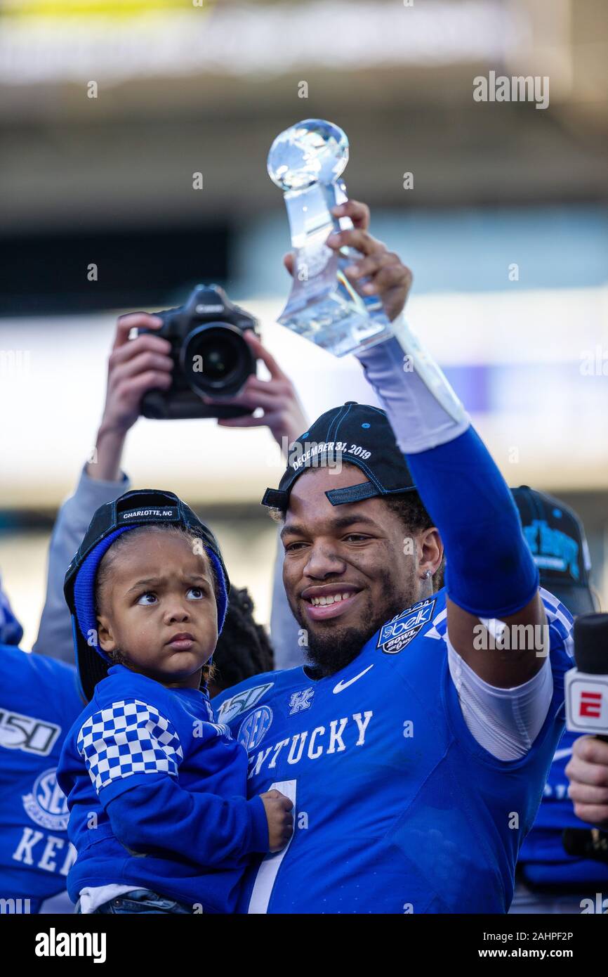 December 31, 2019: Kentucky Wildcats wide receiver Lynn Bowden Jr. (1) holds up the MVP trophy after winning the 2019 Belk Bowl at Bank of America Stadium in Charlotte, NC. (Scott Kinser/Cal Sport Media) Stock Photo