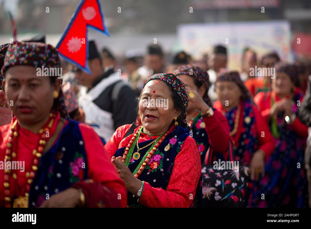 Nepalese women dressed in a traditional attires during the celebration.The Tamu or Gurung people (community) of central Nepal celebrate their new year annually on the public holiday called “Tamu Losar”. This is a time of great family gatherings, feasts, and joyful cultural events. The holiday is based on local calendar systems, but tends to fall near the end of December, not far from Gregorian New Year’s Day. Stock Photo