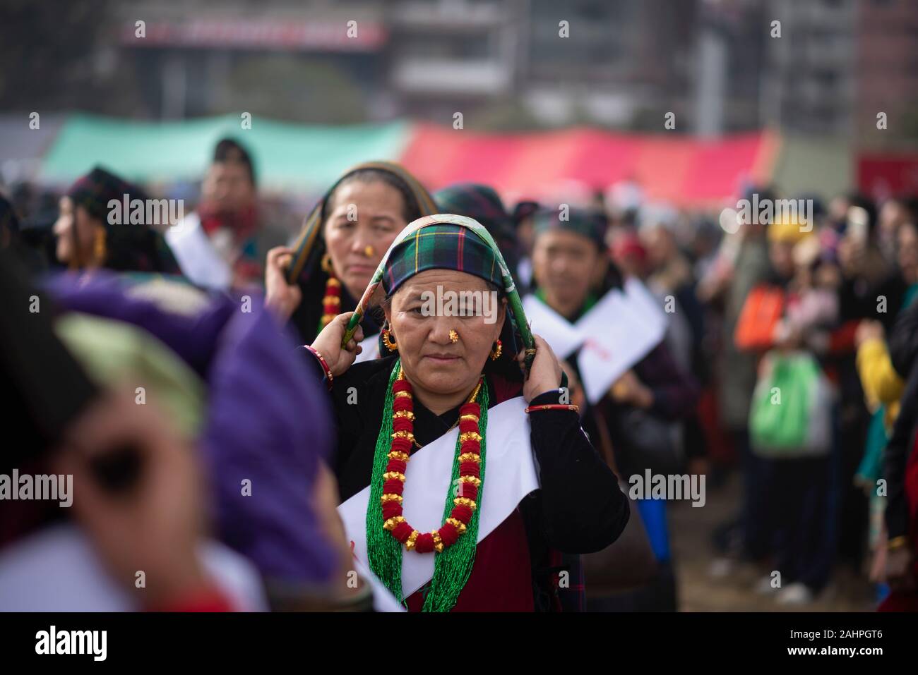 Nepalese women dressed in a traditional attires during the celebration.The Tamu or Gurung people (community) of central Nepal celebrate their new year annually on the public holiday called “Tamu Losar”. This is a time of great family gatherings, feasts, and joyful cultural events. The holiday is based on local calendar systems, but tends to fall near the end of December, not far from Gregorian New Year’s Day. Stock Photo