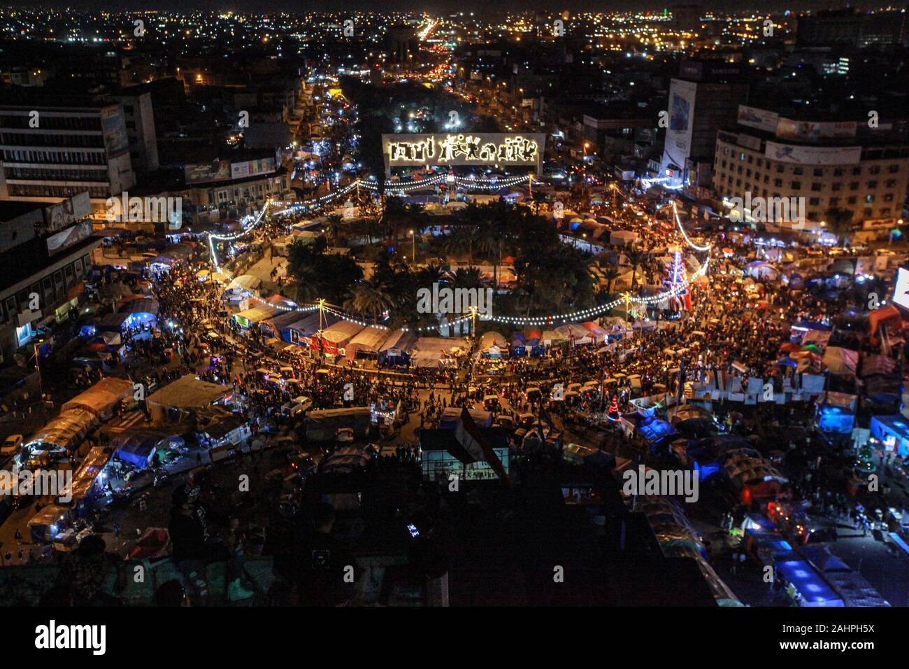Baghdad, Iraq. 31st Dec, 2019. Iraqi people gather at Tahrir Square to