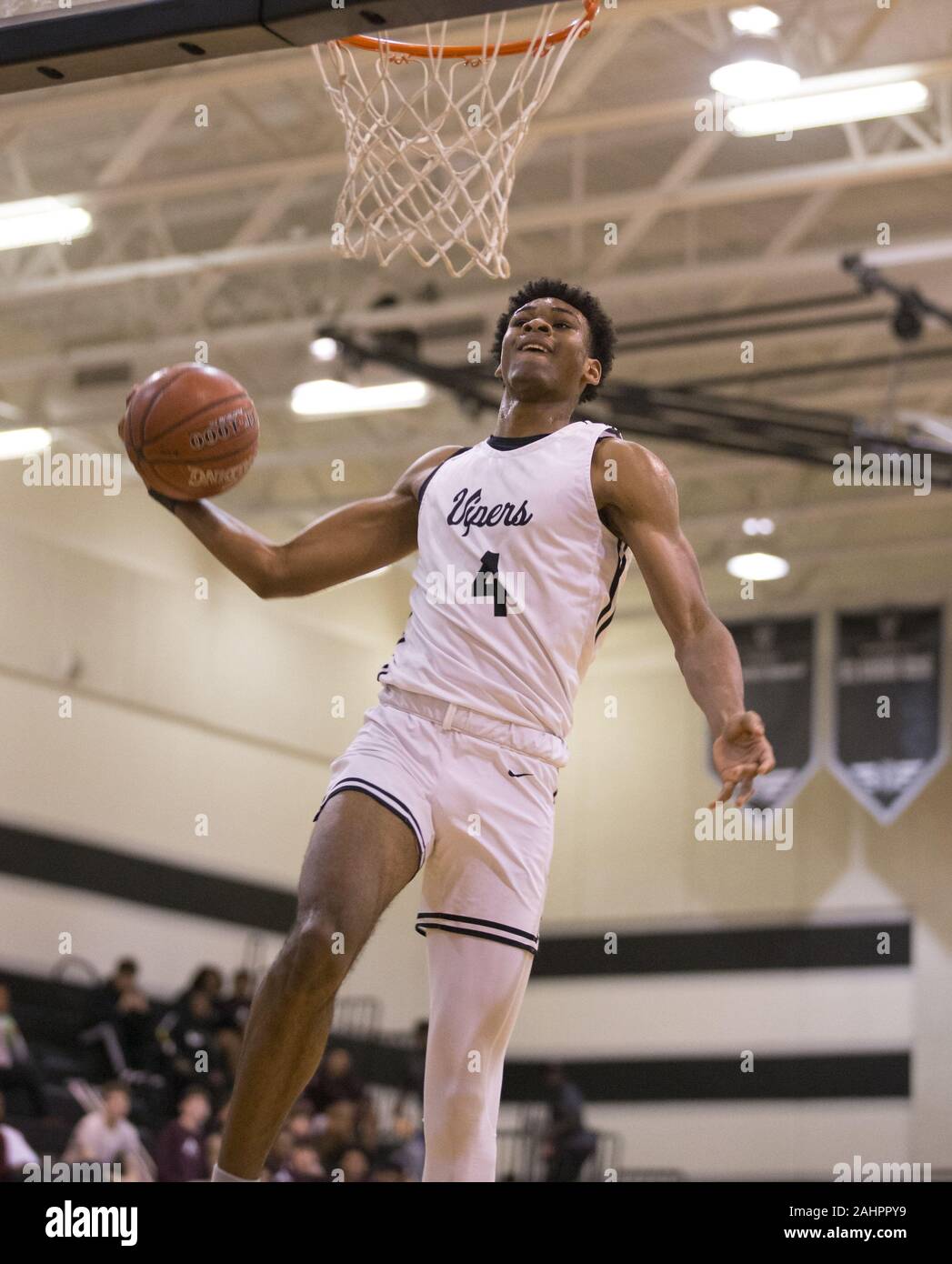 Austin, Texas, USA. 31st Dec, 2019. Vandegrift Vipers forward Greg Brown  (4) goes up for a dunk during a high school basketball game in Austin,  Texas, on Dec. 31, 2019. Brown is