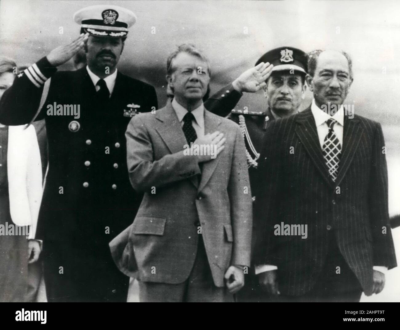 President JIMMY CARTER, center, holds his hand over his heart as he arrives in Egypt for peace talks. 8th Mar, 1979. President Carter and Egyptian President ANWAR SADAT are at the airport after Carter arrived in Cairo to meet with President Sadat and address the People's Assembly. Credit: Keystone Pictures USA/ZUMAPRESS.com/Alamy Live News Stock Photo
