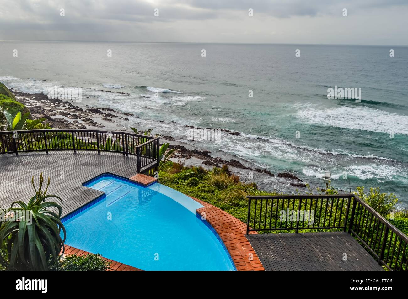 Outdoor jacuzzi and luxurious spa bath and infinity pool along Atlantic