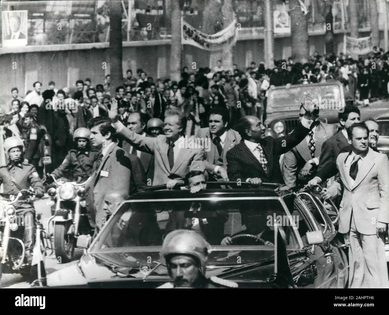 Mar. 8, 1979 - Cairo, Egypt - US President JIMMY CARTER and Egyptian President ANWAR SADAT stand through the roof of a limo and wave to the crowds during the drive from the airport into Cairo. President Carter arrived in Egypt to meet with President Sadat and address the People's Assembly. (Credit Image: © Keystone Press Agency/Keystone USA via ZUMAPRESS.com) Stock Photo