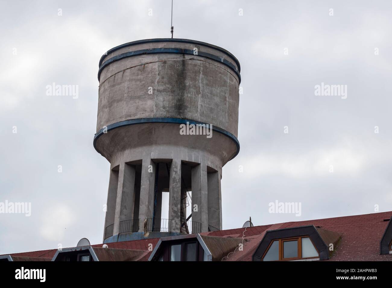 Water tower closeup. It is used where water pressure is not sufficient. Made of concrete Stock
