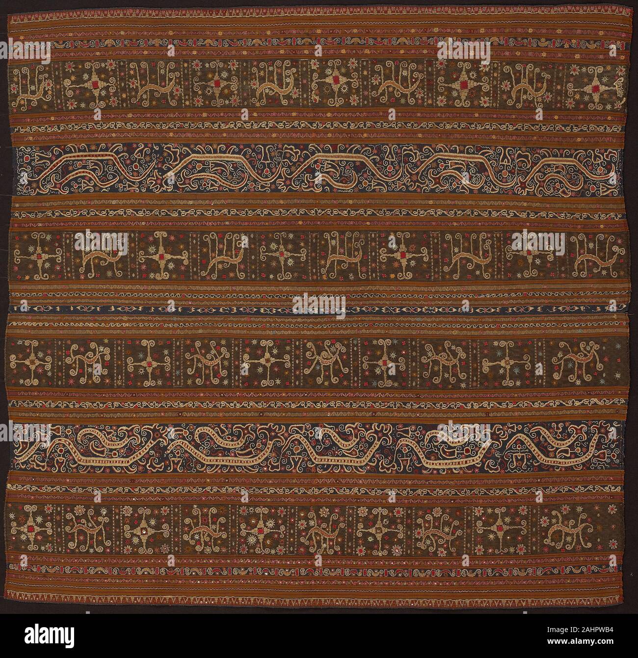Abung. Ceremonial Skirt (tapis). 1801–1825. Indonesia. Two panels joined cotton and silk, stripes of warp-faced, weft ribbed plain weave; warp-faced, weft ribbed plain weave with supplementary brocading wefts, and warp resist dyed (warp ikat) plain weave with supplementary brocading wefts; appliquéd with wool, plain weave; embroidered with silk, cotton, pineapple fiber, silver-leaf-over-lacquered-paper strip wrapped cotton and silver-leaf-over-lacquered-paper strip wrapped bast fiber (probably ramie) in buttonhole, double running, split, stem, straight and surface satin; laidwork and couching; Stock Photo