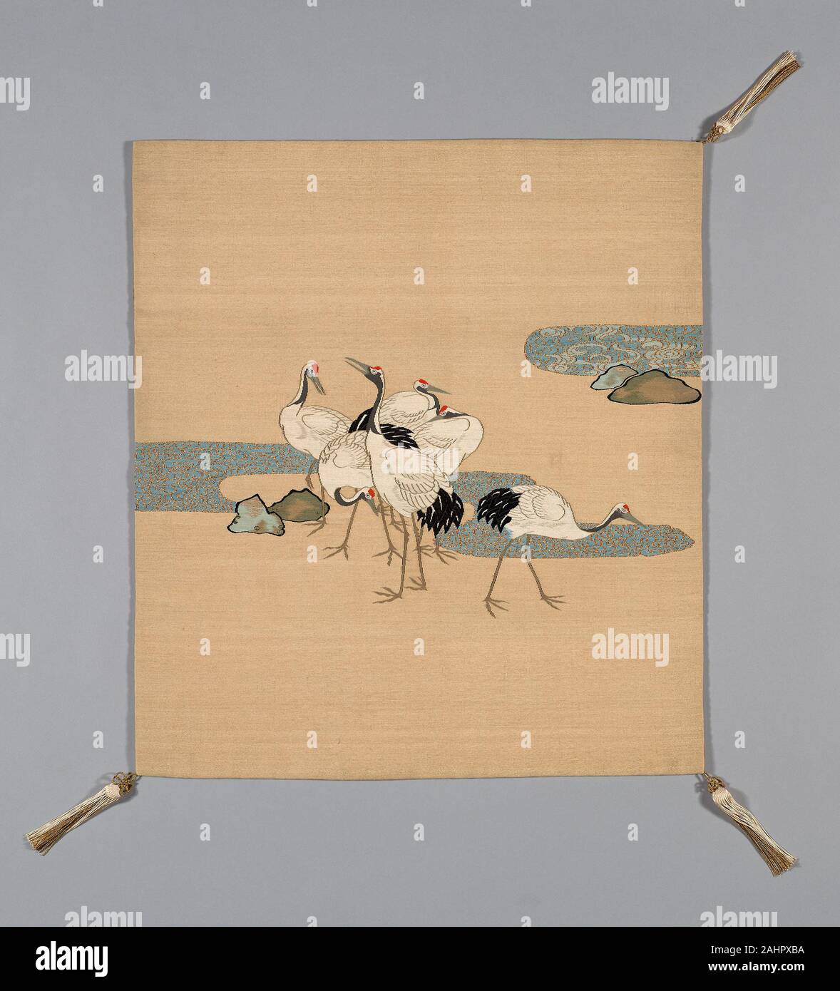 Fukusa (Gift Cover). 1801–1900. Japan. Mon side silk, warp-faced, weft ribbed plain weave (shioze); dye extracted through stenciled chemical dye stripper (bassen); patterned side cotton, silk and gold-leaf-over-lacquered-paper strip wrapped silk, slit tapestry weave with wrapped outlining wefts (tsuzure); paper interlining; Sewn with front and lining matched in size (Tachikiri awase); corners silk, gold-leaf-over-lacquered-paper strip wrapped silk, tubular 1 1 oblique interlacing over cotton core, knotted; silk-wrapped cotton ball and re-plied silk, gold-leaf-over-lacquered-paper strip wrapped Stock Photo
