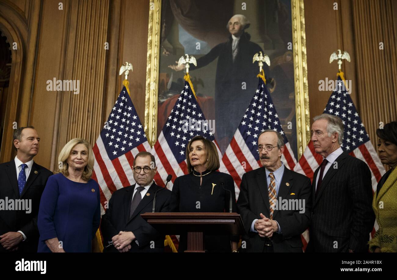 Beijing, DC, USA. 18th Dec, 2019. U.S. House Speaker Nancy Pelosi (C) speaks during a press conference after the House voted to impeach President Donald Trump in Washington, DC, Dec. 18, 2019. Credit: Ting Shen/Xinhua/Alamy Live News Stock Photo