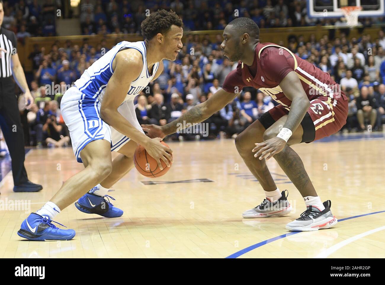 Durham, North Carolina, USA. 31st Dec, 2019. WENDELL MOORE JR., left, of Duke dribbles against JAY HEATH (5) of Boston College. The Duke Blue Devils hosted the Boston College Eagles at the Cameron Indoor Stadium in Durham, N.C. Credit: Fabian Radulescu/ZUMA Wire/Alamy Live News Stock Photo