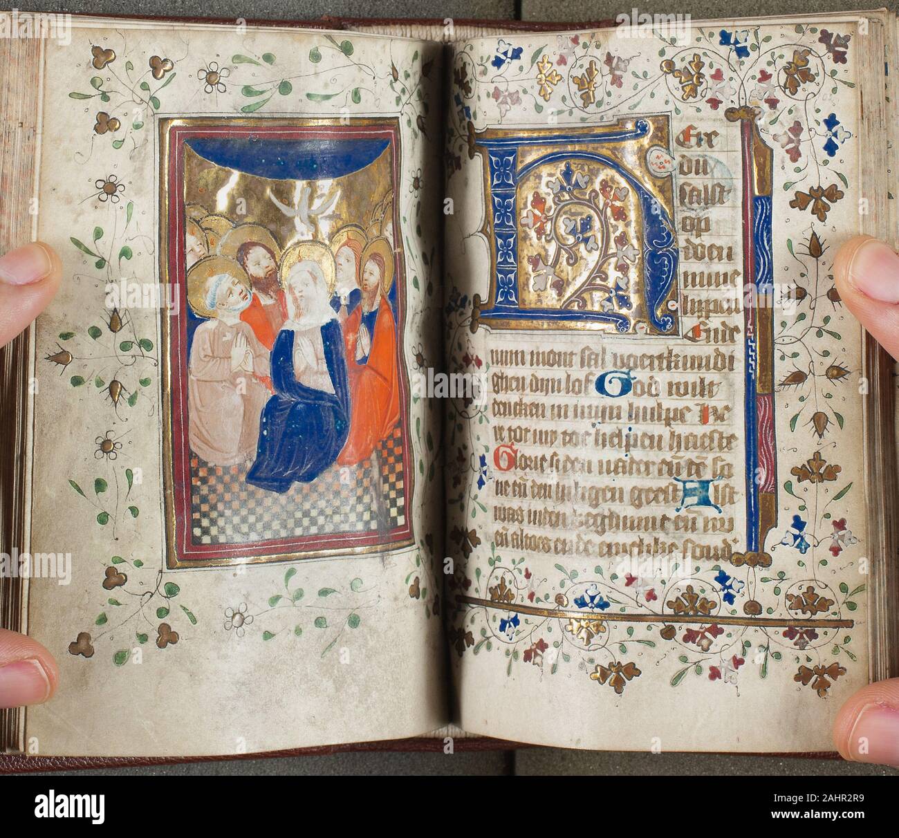 Master of Zweder van Culemborg. Book of Hours. 1410–1430. Netherlands. Manuscript with 259 folios, six miniatures and other decorations in tempera and gold leaf, with Dutch inscriptions in littera textualis, in blackish brown ink, ruled in graphite, on parchment, in a modern binding of brown morocco over wooden boards, with stamped designs on the endbands, and with machine cut edges, marbled in red and blue Stock Photo