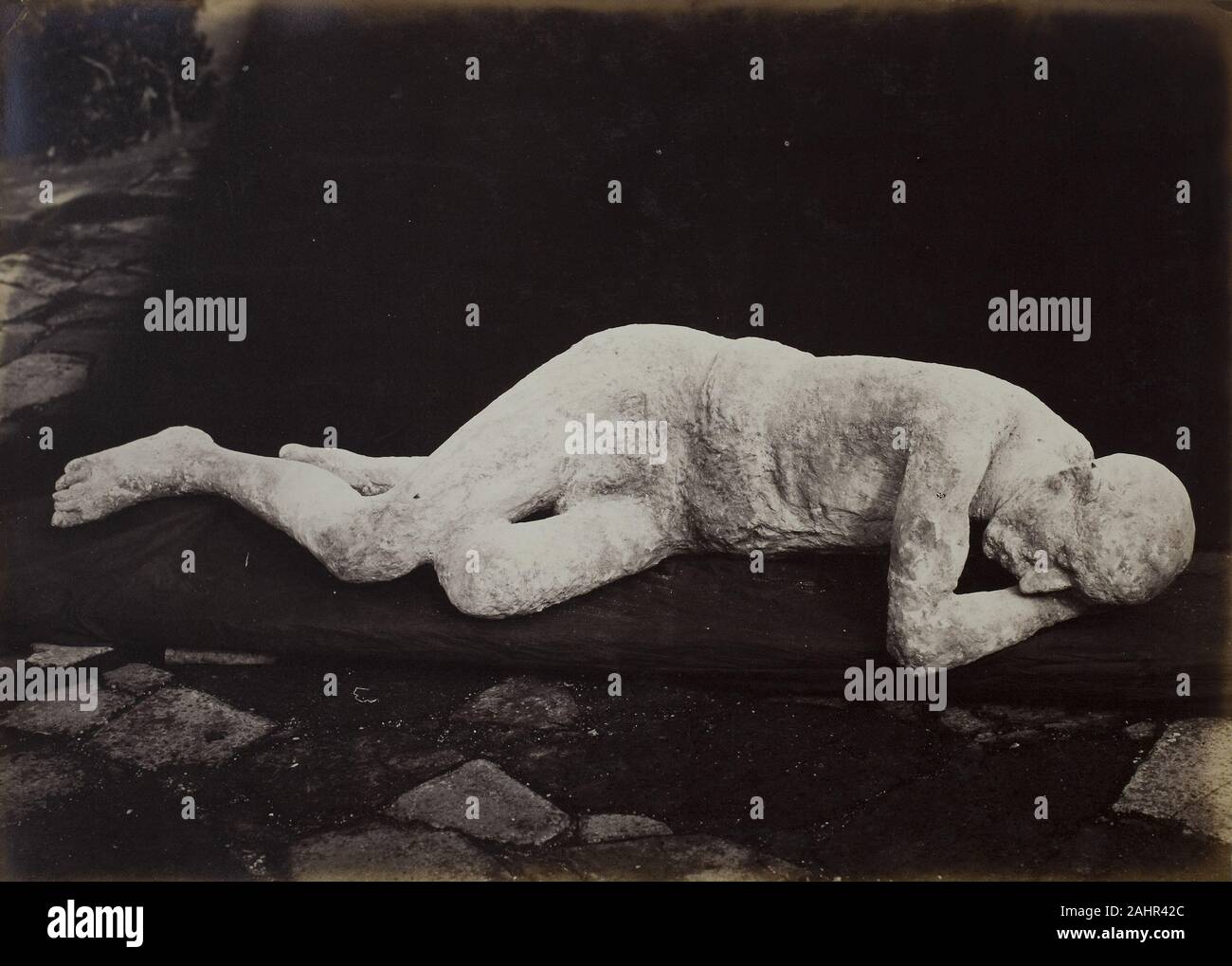 Giorgio Sommer. Body Cast from Pompeii. 1880. Italy. Albumen print Giorgio Sommer was one of the most successful and well-known photographers of southern Italy in the nineteenth century, and his images served archaeologists and tourists alike. He was commissioned by Giuseppe Fiorelli, the first archaeologist to bring scientific method to the excavations at Pompeii. Under Fiorelli, archaeological evidence was to be documented at the site of its discovery, a dramatic shift from the antiquarian emphasis on aesthetics toward an anthropological appreciation of social and material context. Thus cavi Stock Photo